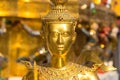 Theppaksi Gold statue. Asian art close up