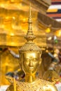 Theppaksi Gold statue. Asian art close up