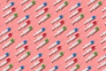 Therapeutic pattern of plastic syrenges with colorful vaccines. Royalty Free Stock Photo