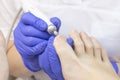 Therapeutic pedicure. Master podologist does hardware pedicure. visit to the podiatry. Foot treatment in the spa.