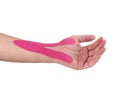 Therapeutic treatment of wrist with kinesio tex tape. Royalty Free Stock Photo