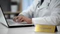 Therapeutist filling out medical forms, prescribing medication to patient Royalty Free Stock Photo