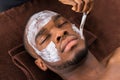 Therapist Applying Face Mask To Man Royalty Free Stock Photo