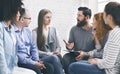 Therapist consulting patients of rehab group at therapy session Royalty Free Stock Photo