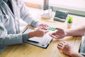 Therapist consulting to patient male patient about pills writing his medical prescription drug in the office Royalty Free Stock Photo