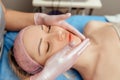 Face massage on woman in the spa salon