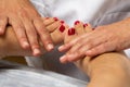 Therapist doing manipulative treatment on human feet Royalty Free Stock Photo