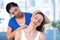 Therapist examining her patients neck