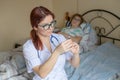 Therapist gives an intramuscular injection to an elderly woman. A nurse holds a syringe with medicine for a senior Royalty Free Stock Photo