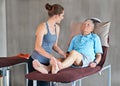 Therapist, legs and senior patient with physical therapy exercise at rehabilitation center. Medical, help and Royalty Free Stock Photo