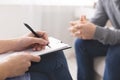 Therapist noting patient speech during personal session
