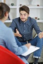 therapist sitting in front patient with paper and pen Royalty Free Stock Photo