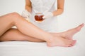 Therapist waxing womans leg at spa center Royalty Free Stock Photo