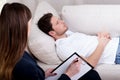 Therapist working with patient on hypnosis Royalty Free Stock Photo