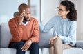 Therapy, counselling and mental health support for black man patient on psychologist couch. Person talking to woman Royalty Free Stock Photo