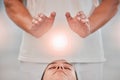 Therapy, massage and reiki with digital overlay above the head of a woman client in a spa to relax. Hands, special