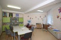 Therapy rehabilitation playroom for children: table, chairs, toys and rehabilitation equipment