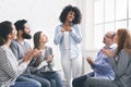 African woman sharing her achievement with rehab group Royalty Free Stock Photo