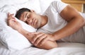 Is there anything better than a lie in. Shot of a young man sleeping in bed. Royalty Free Stock Photo