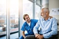 Is there anything else I can help with. a male nurse caring for a senior patient. Royalty Free Stock Photo