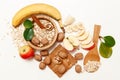 There are Banana,Apple,Orange with Walnuts in the Wooden Plate and Rolled Oats,Wooden Spoon,Trivet,with Green Leaves,Healthy Fresh