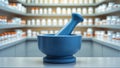 there is a blue mortar and a bottle on a counter Royalty Free Stock Photo