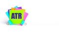 There are bright multi-colored stickers with the text ATR Average True Range. Copy space