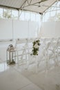 there is a bunch of white chairs set up for a wedding