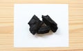 Carbon and bamboo charcoal soap on wood background