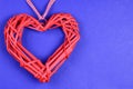 On a blue background on the left side there is a decorative large red heart. On the right is a place for an inscription Royalty Free Stock Photo