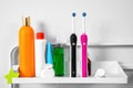 There are dental floss in box, toothpaste, two electric toothbrushes, tubes with various hygiene products, skin care and cleansing