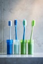 there are different colored toothbrushes in cup holders near the sink Royalty Free Stock Photo