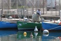 Working fisherman in french Port de Rives of Thonon-les-Bains Royalty Free Stock Photo