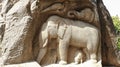 There is an elephant carved in the rock and some sculptures in it. Royalty Free Stock Photo