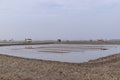 There are farms and roads made of soil on the dark beach