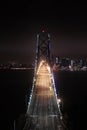 Bay Bridge Illuminated in the Night and San Francisco Blanketed by the Clouds