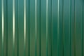 Green metal profile for fences, roofs, walls Royalty Free Stock Photo