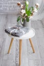 There is a gift on the white tabouret. Royalty Free Stock Photo