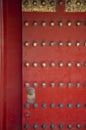 There is a bronze lion bolt on the beautiful Chinese retro door