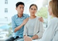 There has to be something you can do. Shot of a mature doctor comforting a young couple while delivering some bad news Royalty Free Stock Photo