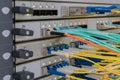 There are high speed central router interfaces in the server room. Fiber optic data transmission wires. Modern cable internet