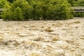 Whitecaps and Whirlpools Can Be Seen in a Turbulent River after Heavy Rains.