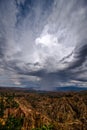 Yuanmou soil forest with full of cumulonimbus clouds Royalty Free Stock Photo