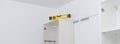 There is a level on the hanging kitchen cabinet to check the evenness of the installation of kitchen furniture, long photo