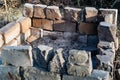 There is a lot of ash after the fire, a special place for burning, lined with concrete bricks, burnt remnants of the fire.