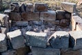 There is a lot of ash after the fire, a special place for burning, lined with concrete bricks, burnt remnants of the fire.