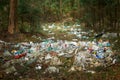 There is lot of garbage in forest. The concept of human pollution of forests and nature. A terrible dump in the woods