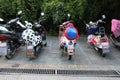 There are many brightly colored electric bicycles on the streets of Dali