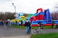 there are many inflatables and inflatable slides along the field