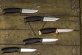 There are many knives on the table. Unidirectional knives. Flying knives Royalty Free Stock Photo